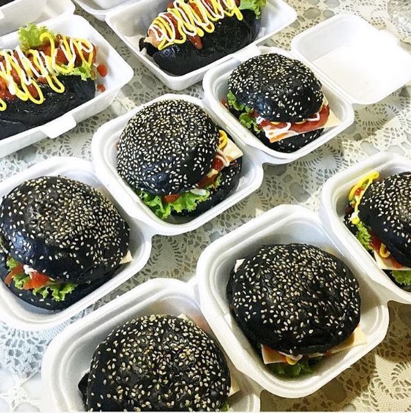black burgers and hot dogs